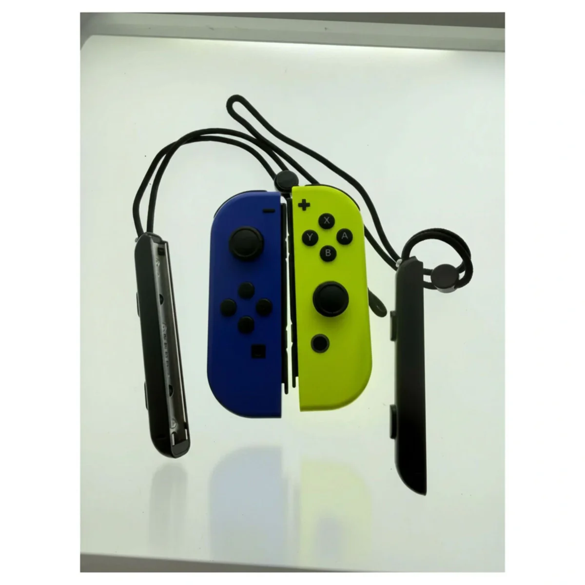 Joy-Con set — Neon Blauw / Neon Geel (met polsbandjes) Nintendo Switch Detail — Los accessoire
