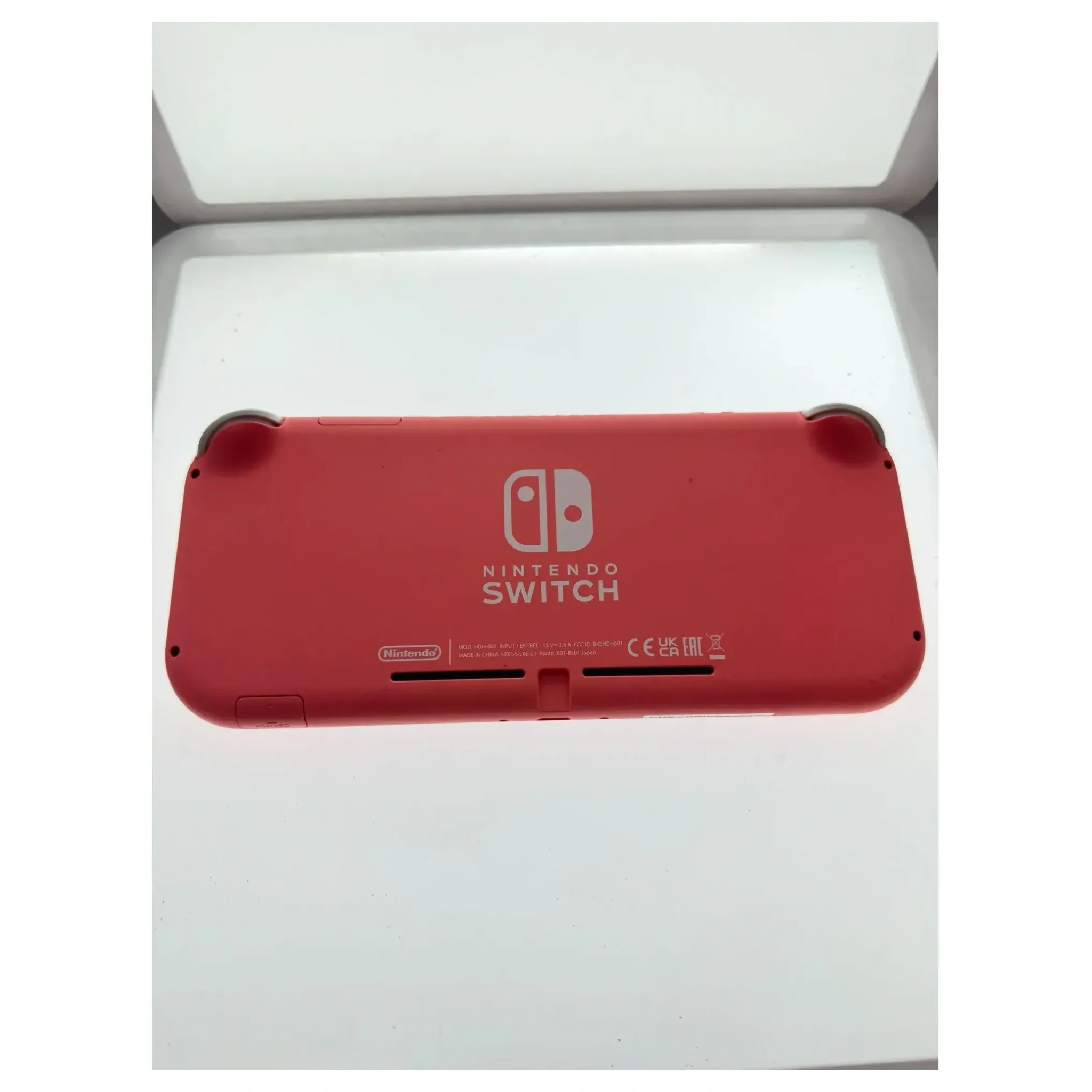 Nintendo Switch Lite Coral Nintendo Switch Achterkant — Losse console